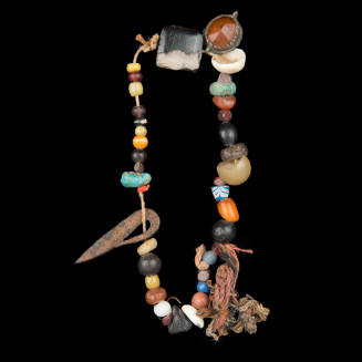 Talismanic beads with a miniature iron dagger
