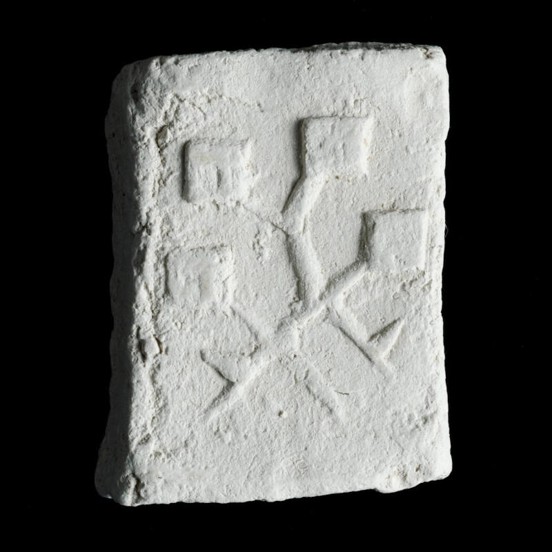 Sacred clay tablet with plant-like form 