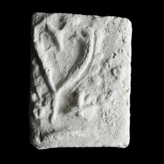 Sacred clay tablet with large heart at upper left