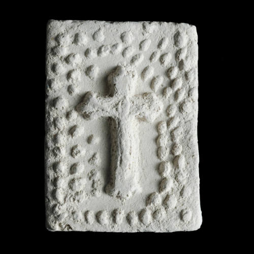 Sacred clay tablet with crucifix under arch of many small flowers