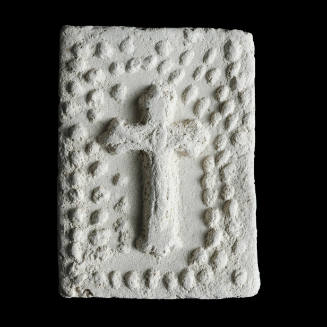 Sacred clay tablet with crucifix under arch of many small flowers