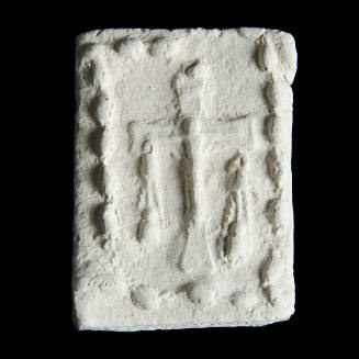 Sacred clay tablet with crucifix in center and row of flowers or beads around perimeter