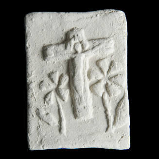 Sacred clay tablet with crucifix in center and large flowers below