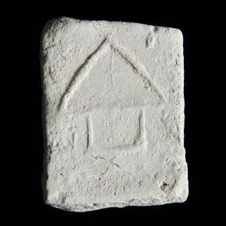 Sacred clay tablet with simple architectural design 