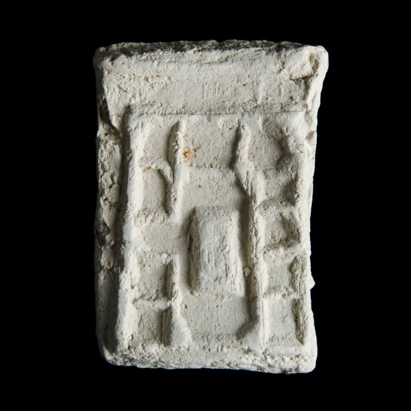 Sacred clay tablet with linear geometric design around a cross