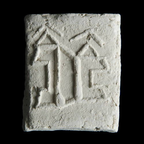 Sacred clay tablet with complex abstract design