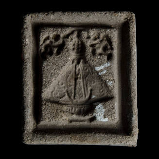 Sacred clay tablet mold of Virgin with six raised dots in crown