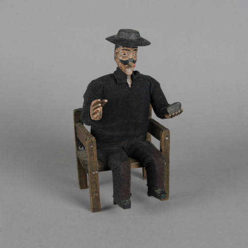 Seated Maximón figure