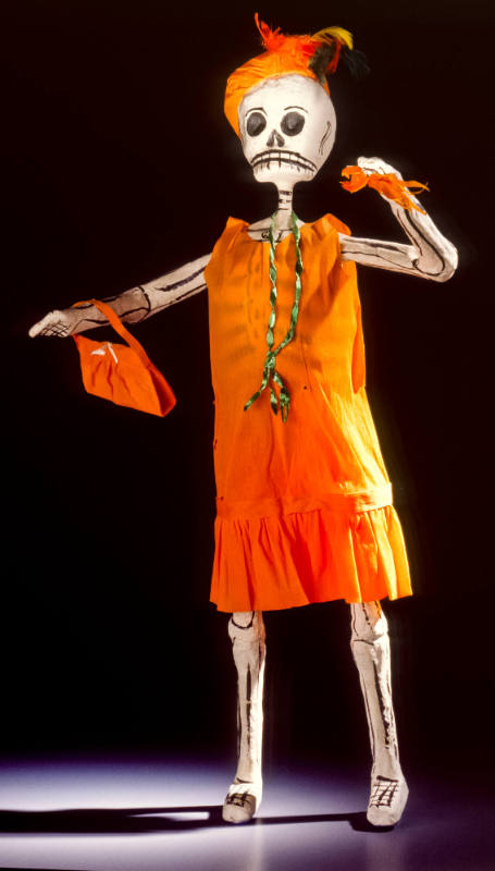 Figure, skeleton in orange dress