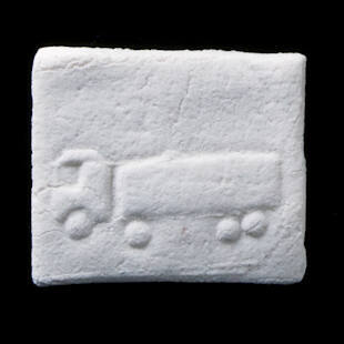 Impressed clay tablet votive offering with truck