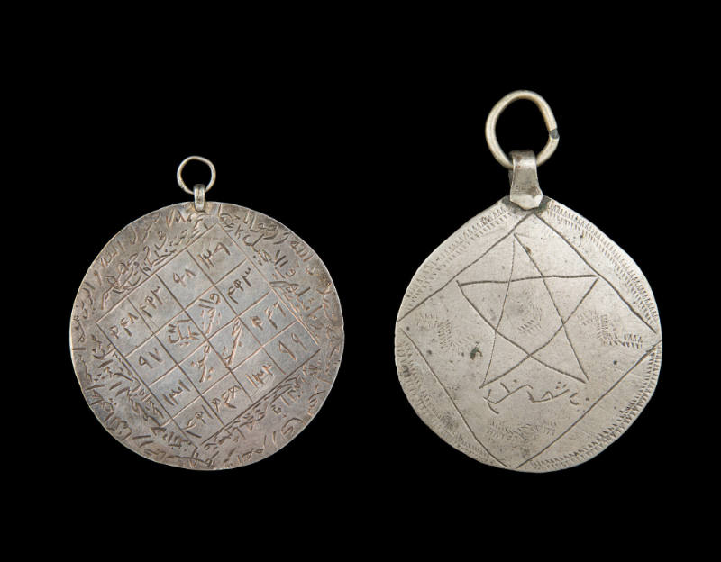 Double-sided pendant with magic squares containing Arabic writing
