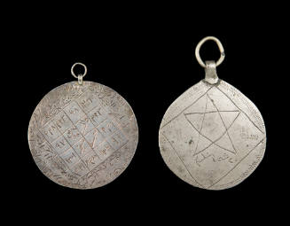 Double-sided pendant with magic squares containing Arabic writing
