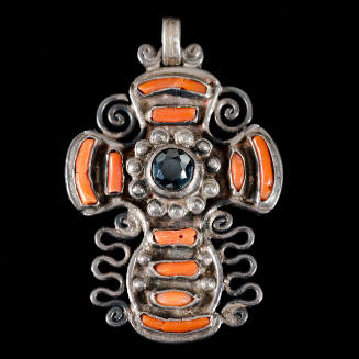 Cross pendant with inlaid stones