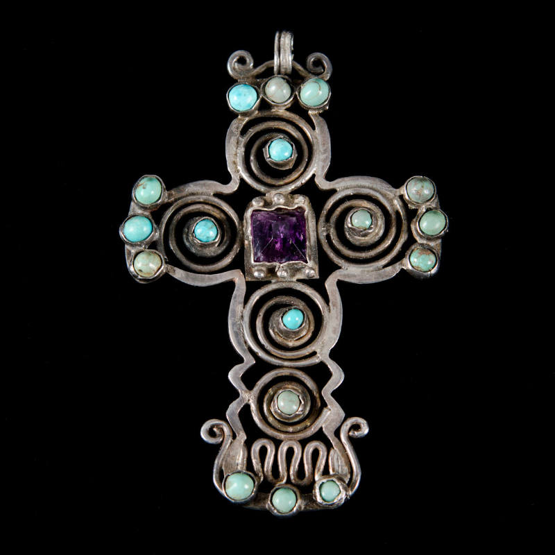 Cross pendant with inlaid stones