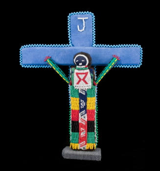 Beaded cross figure with AIDS ribbon