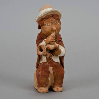 Figural whistle, man playing horn