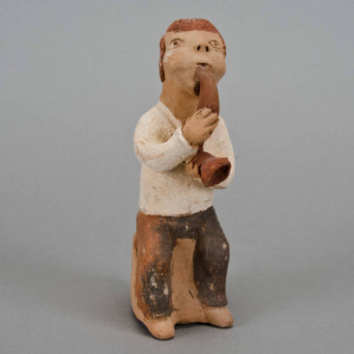 Figural whistle, man playing horn