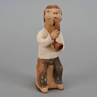 Figural whistle, man playing horn