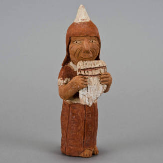Figural whistle, pipe player