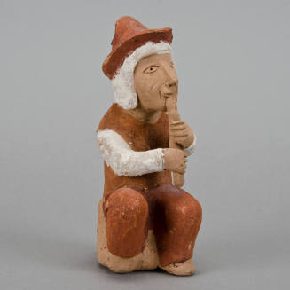Figural whistle, flute player