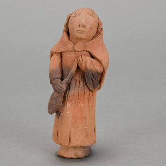 Figural whistle, woman spinning wool