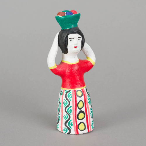 Figure, woman with bowl of fruit on head