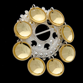 Brooch with hanging disks/leaves
