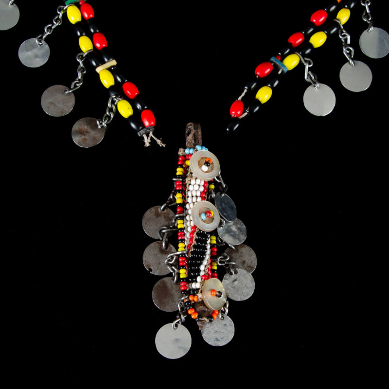Necklace of beads w/metal dangles and cylindrical pendant