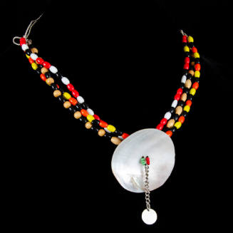 Necklace of beads with shell disk
