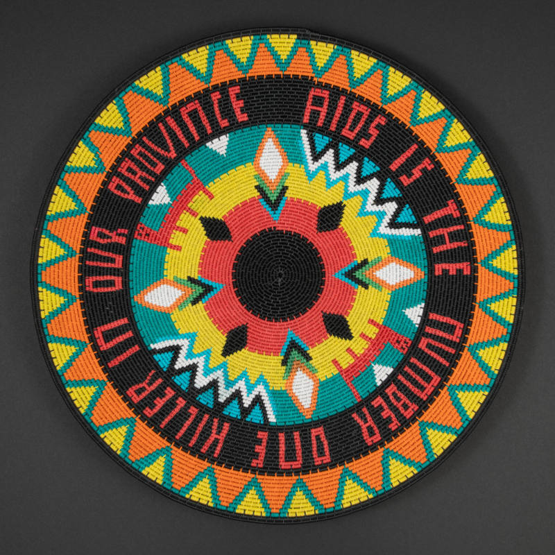 Wire basket, "AIDS is the Number One Killer in Our Province"