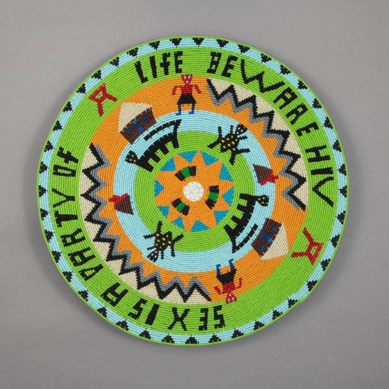 Wire basket, "Sex is a party of life - Beware HIV"