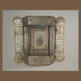 Tin Nicho with holy card