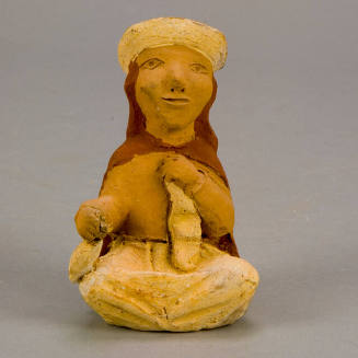 Figural whistle, woman spinning wool