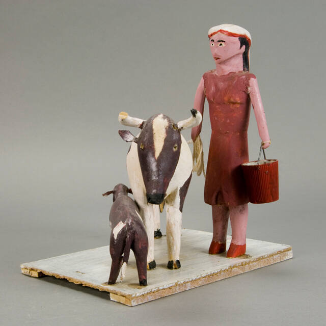 Milkmaid with cows