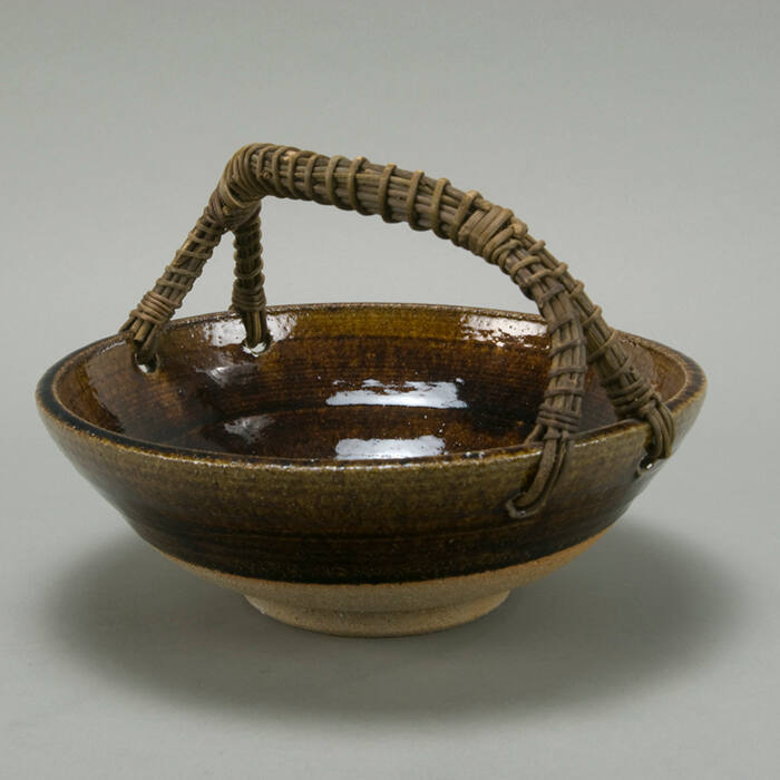 Large brown bowl with handle