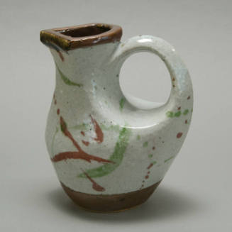 Stoneware Multicolor bird-form water pitcher with box.
