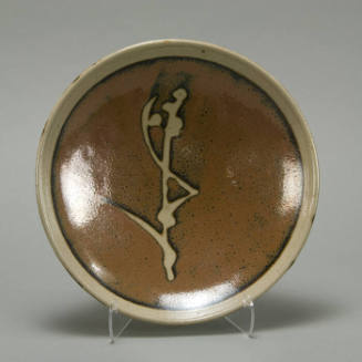 Brown plate with grass design