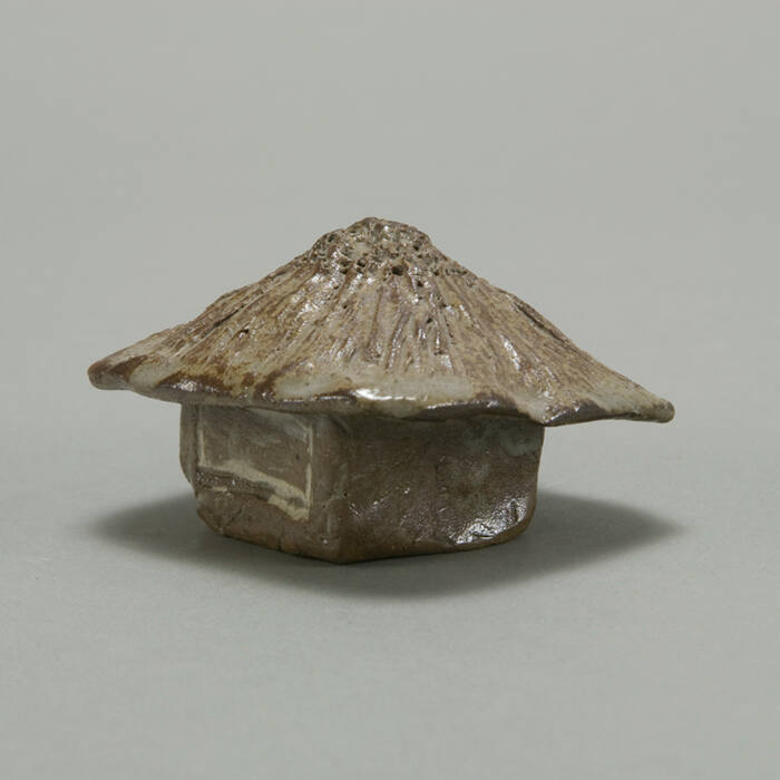 Small house-shaped box with roof as lid