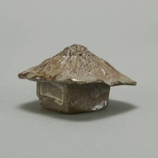 Small house-shaped box with roof as lid