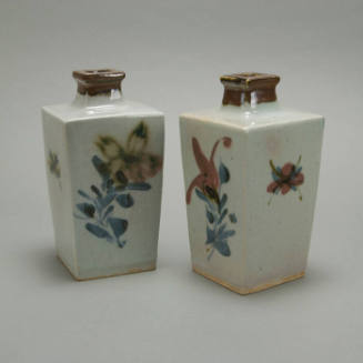 Pair of tall vases with flat sides & abstract floral design.