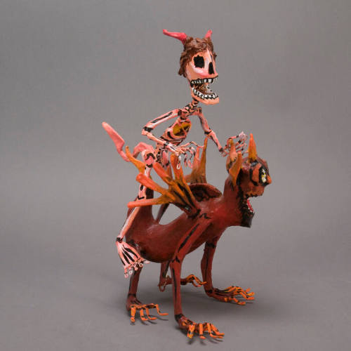 Sculpture, skeleton on devil's back
