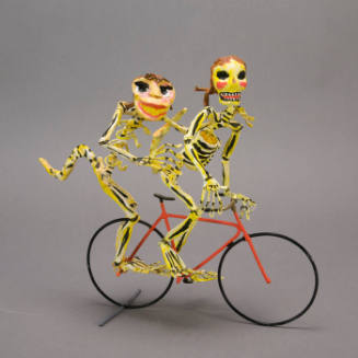 Sculpture, skeletons on bicycle