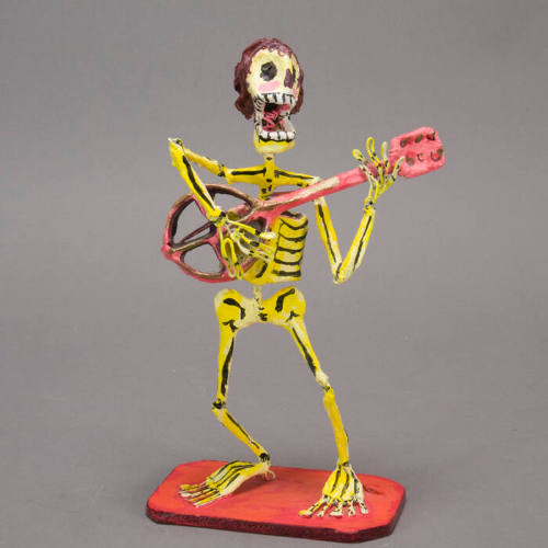 Skeleton with guitar sculpture