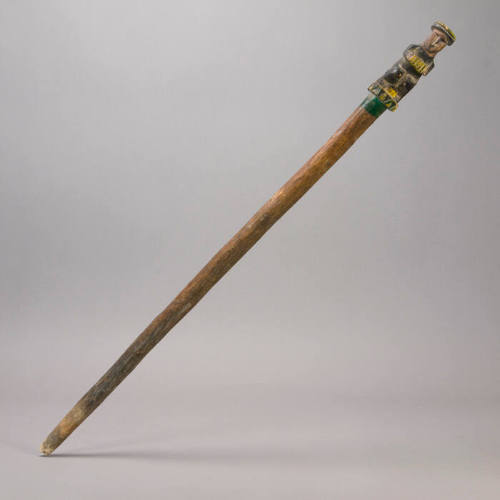 Staff, male figure