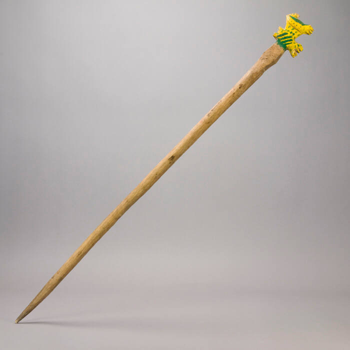 Staff, green and yellow figure