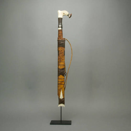 Sword with carved wood sheath