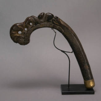 Sickle handle, lion and prey