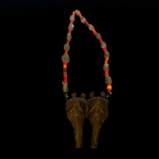 Bead necklace with brass pendant