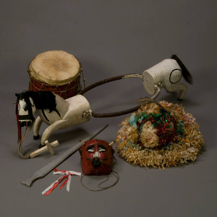 Santiago dance mask, hat, hobby horse, drum and sword.