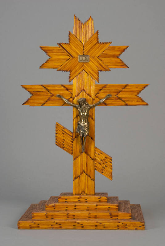 Match stick cross with large silver metal Christ